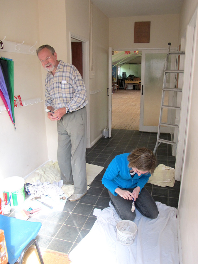 Laura and Jeff Keighley freshening up the foyer